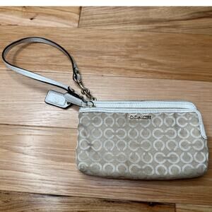 Coach: Tan Graphic Wristlet